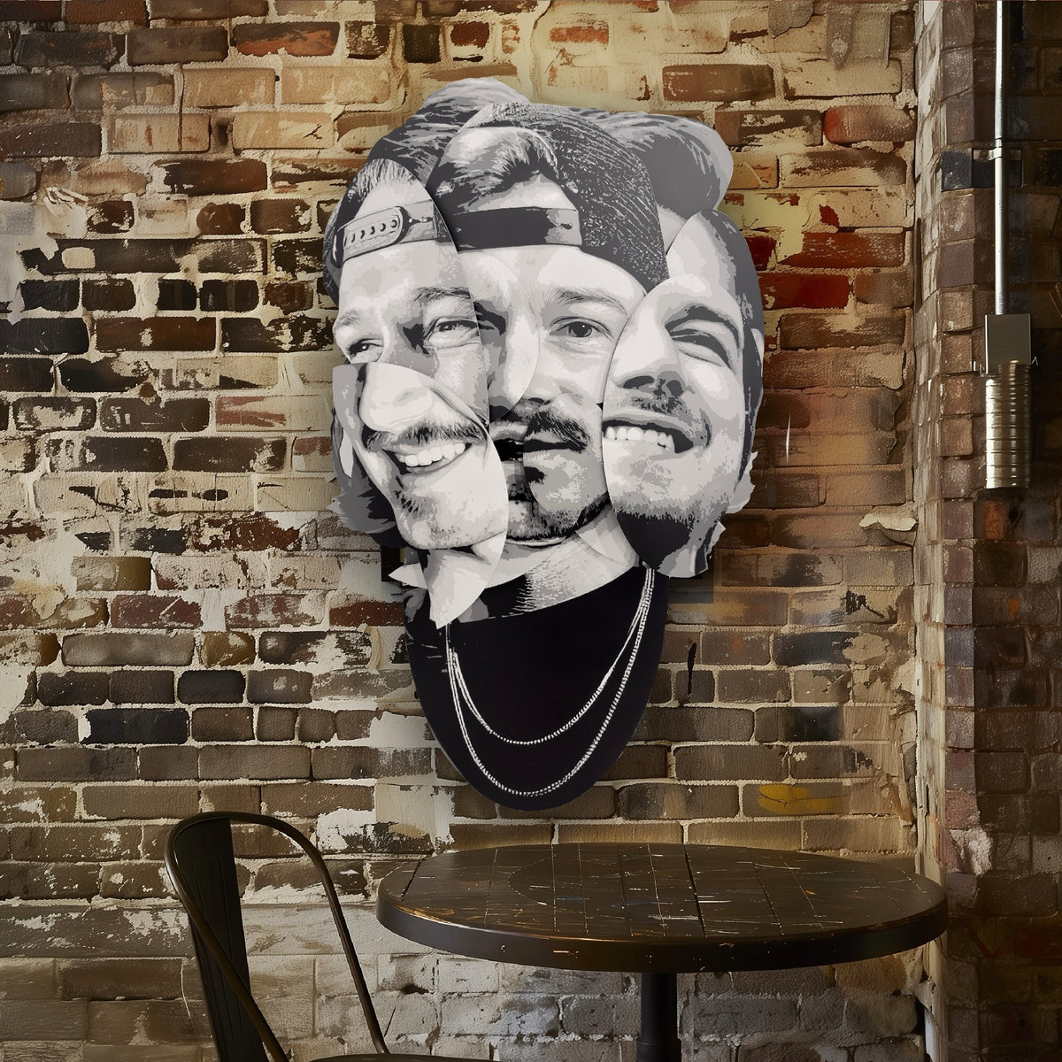 “Parts of the Problem by Ripley, a layered grayscale portrait of Morgan Wallen on a brick wall above a café table.” A large black and white collage wall art piece featuring three overlapping male faces, mounted on a rustic brick wall above a small round table in a cafe-like interior.