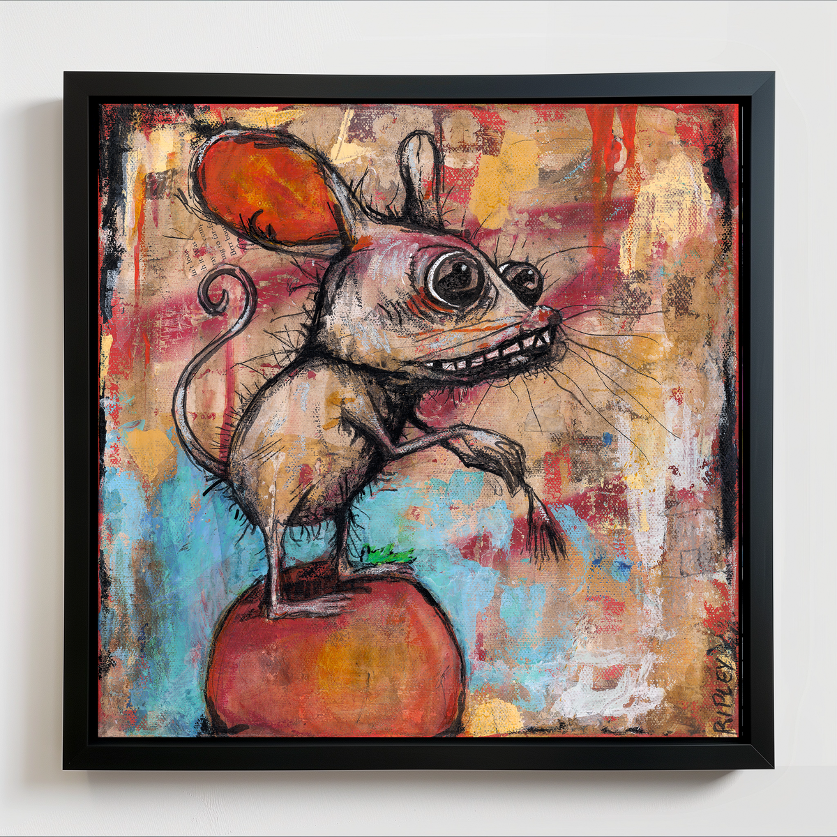 A framed abstract art print featuring a stylized mouse standing on a red-orange shape against a multicolored painted background, shown hanging on a light wall.