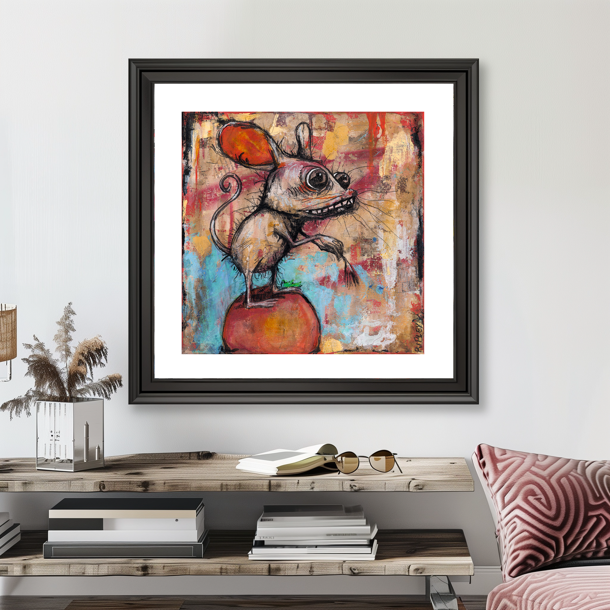 A framed abstract art print featuring a stylized mouse on an apple, displayed on a light gray wall above a wooden console table in a modern living room setting.