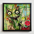 Framed wall art featuring a colorful graffiti-style illustration of a green squirrel with large eyes and a red rose in the lower right corner, shown against a white wall.