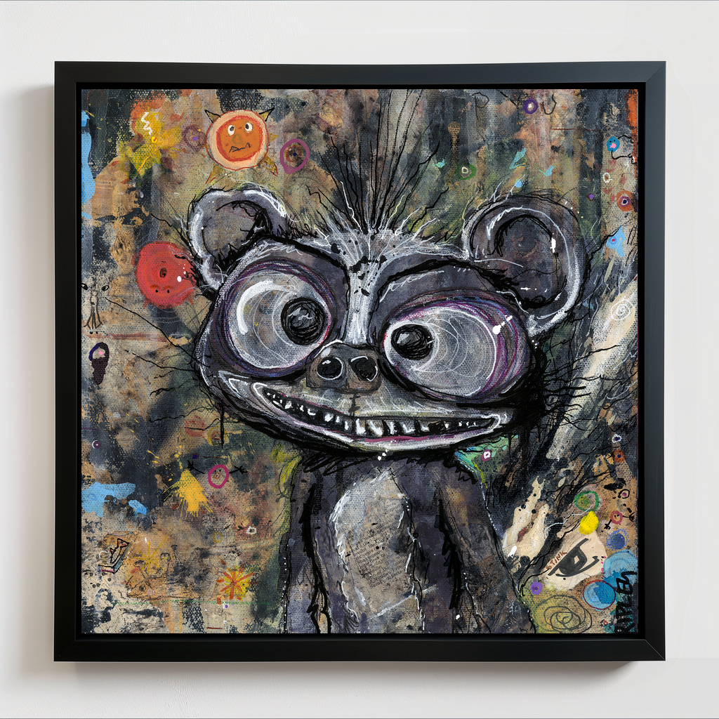 A framed abstract painting of a stylized skunk character with large eyes and a wide grin, shown against a textured multicolor background. The artwork is housed in a black frame and hangs on a light wall.